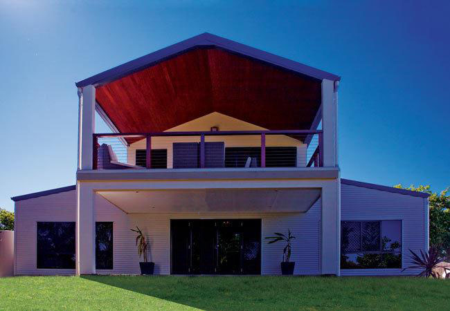 Exterior view of galvanized steel barndominiums in Winslow, Arizona showcasing modern architecture in a rural setting